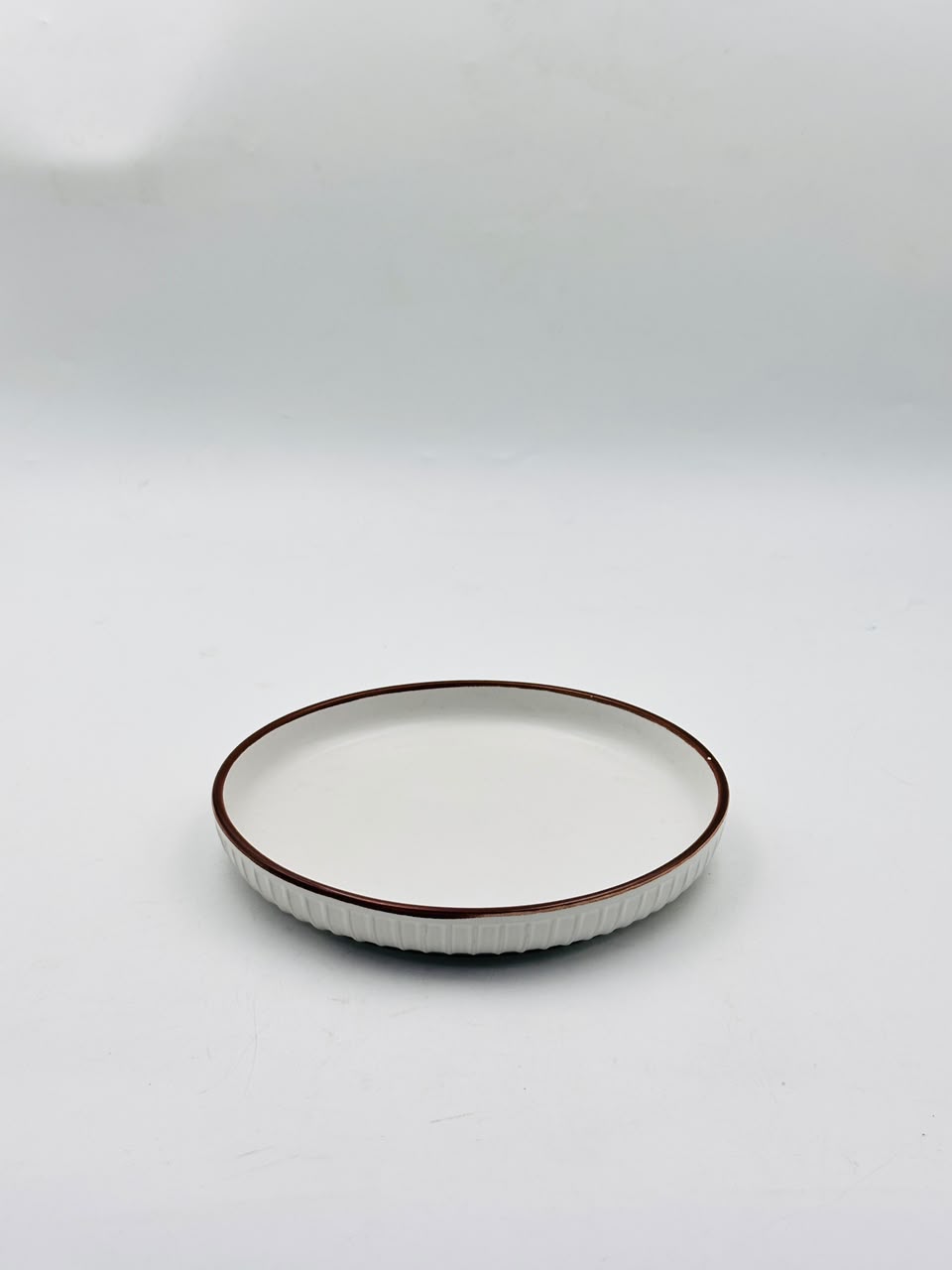 White Ceramic Plate with Brown Rim